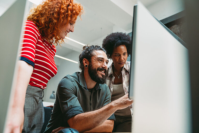 Programmers cooperating at IT company developing apps. People bu